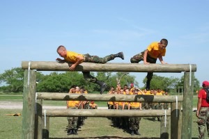 Junior ROTC cadets run the obstacle course