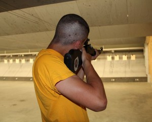 A cadet at the indoor marksmanship center