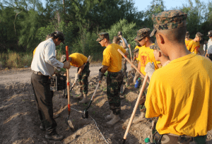 Military school cadet s volunteer for a reforestation project.