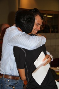 parent hugs son at boarding school registration day
