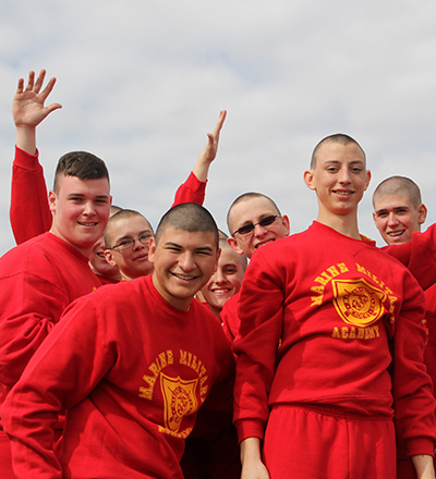 A group of military school cadets in sweat gear.