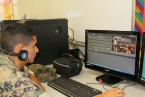a student edits a video using special software