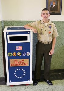 Pilcher stands with flag receptacle